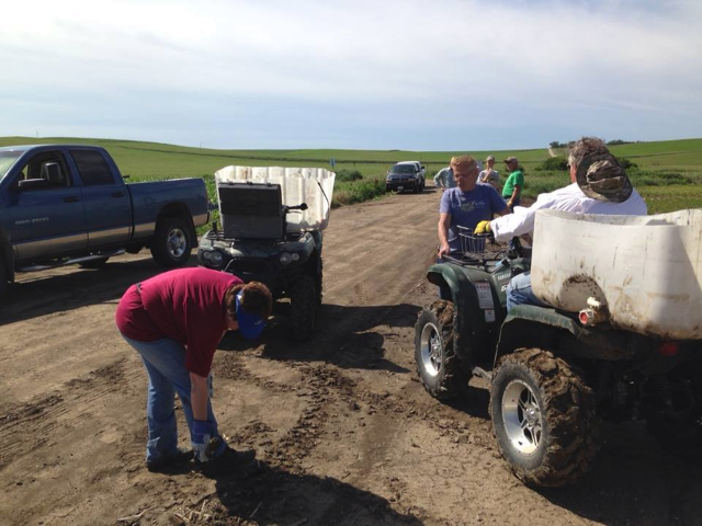 2014-06-24 FCUCC crew walks a field near Wakefield. They got wood and metal and mud 062414